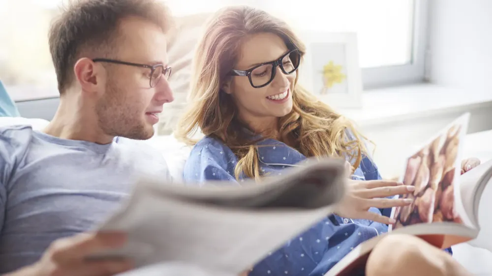 Couple Reading Magazines.